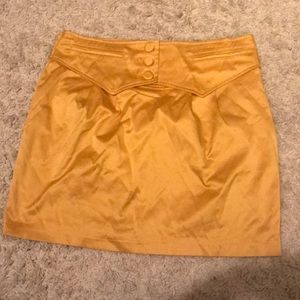 Cute gold mini skirt with button detail
